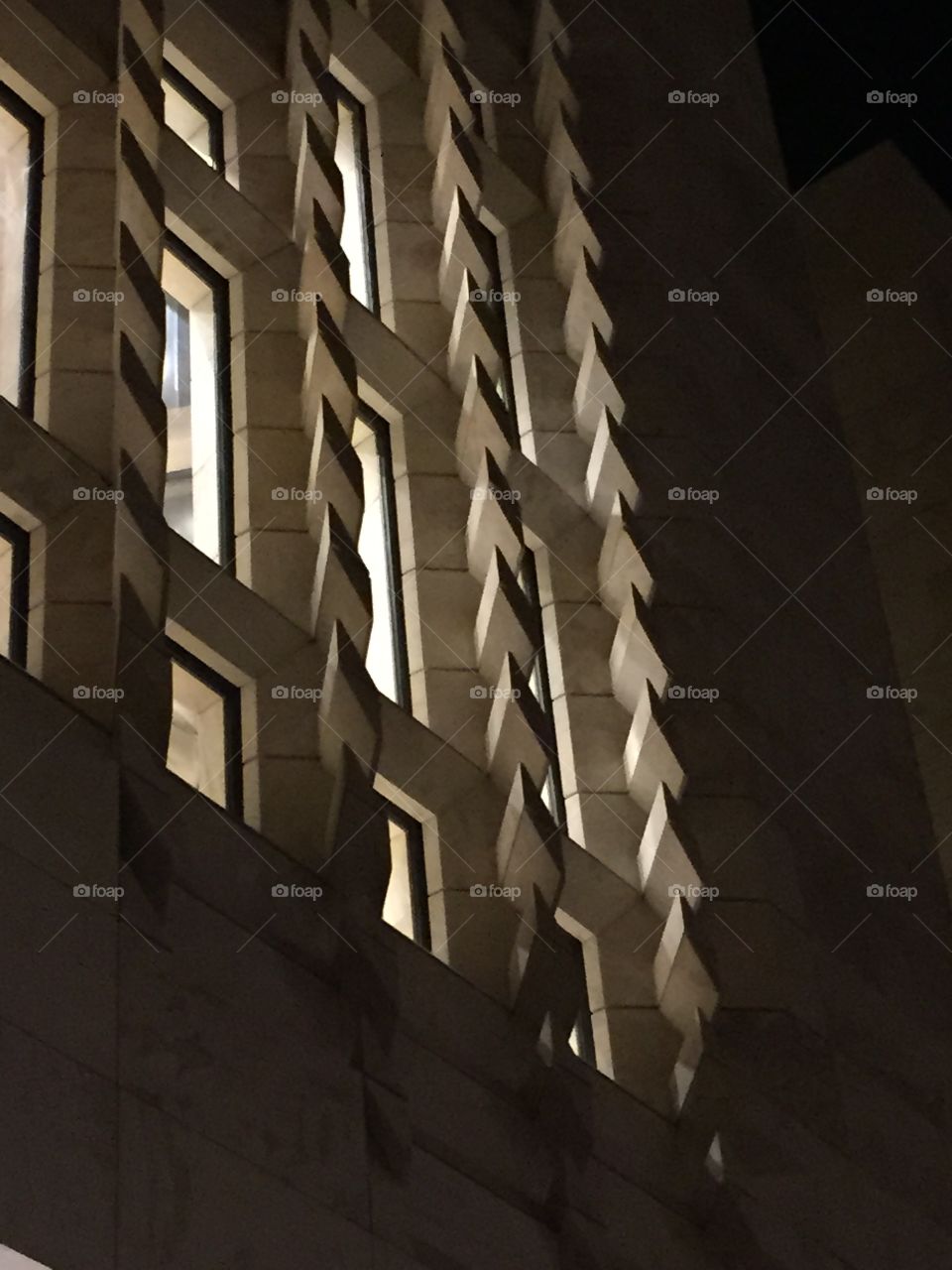 Windows around the world. Illuminated windows at night, in the new and controversial Parliament Building in the Capital City of Valletta in Malta.