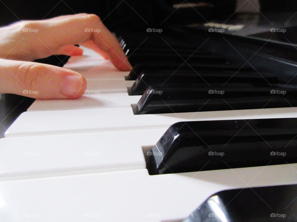close-up piano player