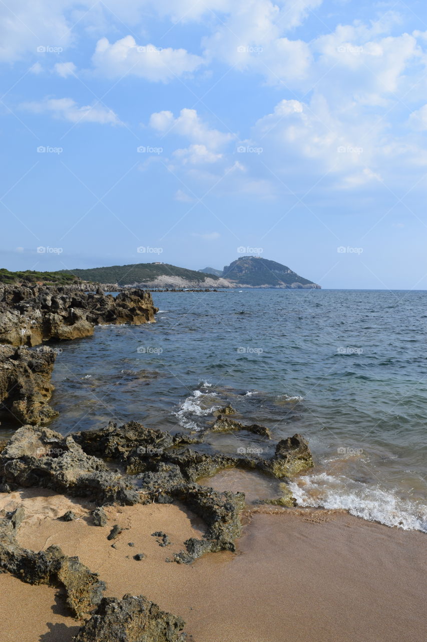 Sea against cloudy sky