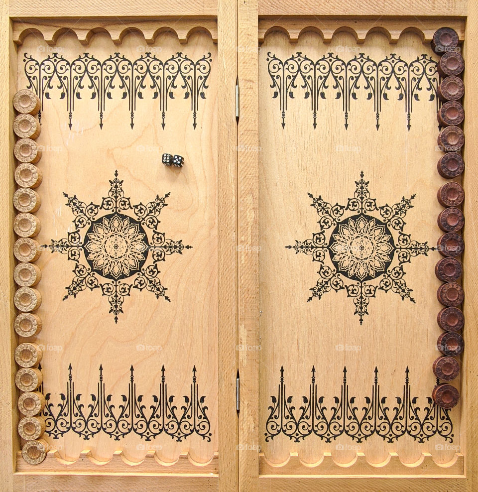 Backgammon, a Board game. A game Board with chips and dice.