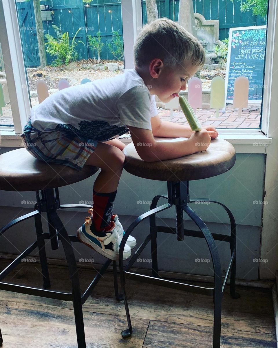 Happiness for some is watching a child enjoy a popsicle. Completely wrapped up in the treat