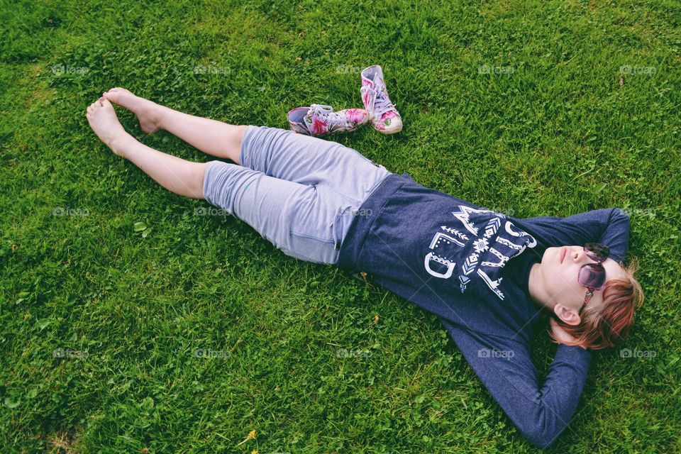 Girl laying in the grass