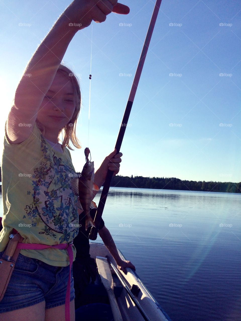 Fishing. Girl caught a fish