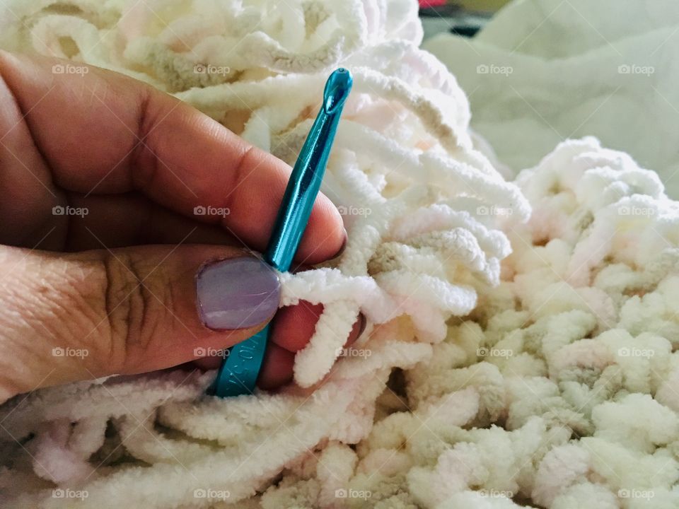 Hand crocheting with soft colored pretty yarn hobby