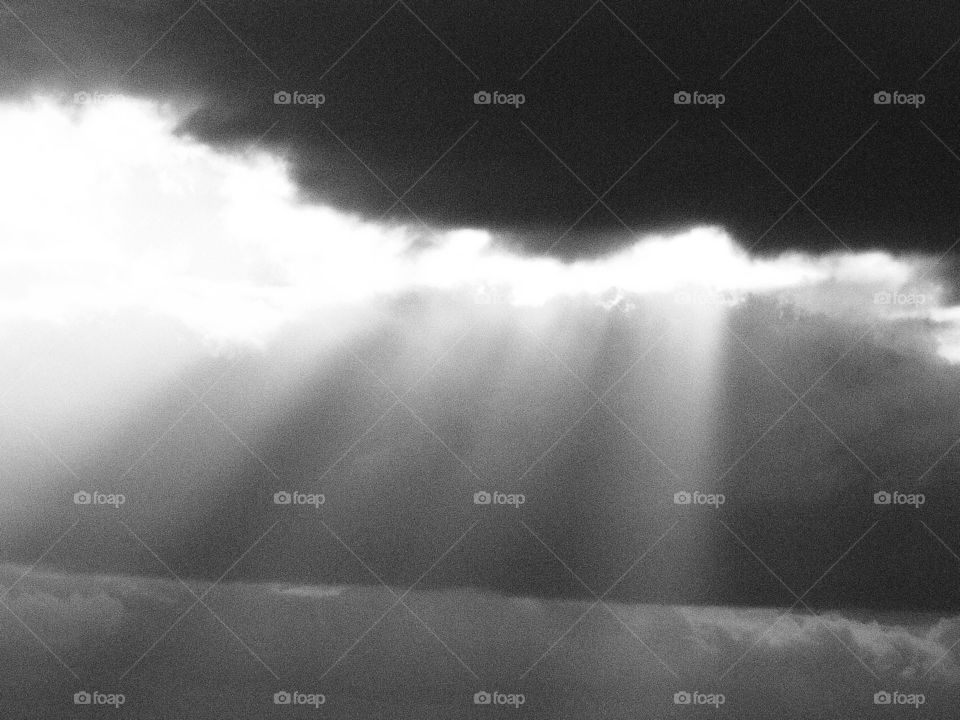 Sun beams breaking through clouds