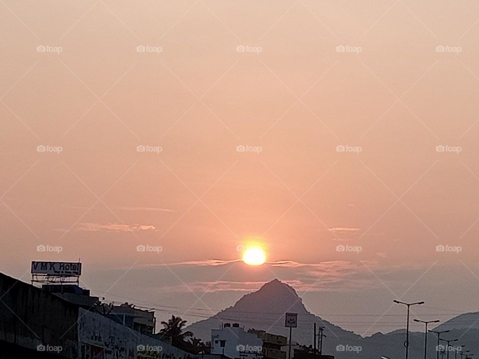 ravarma  Lovely morning, Red sun,  Between the clouds