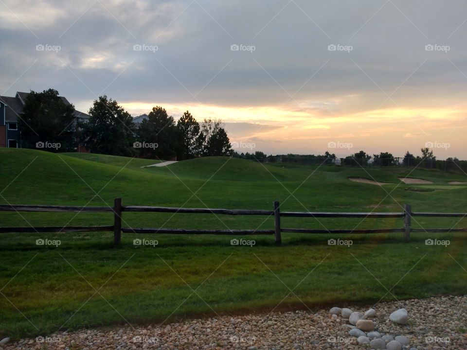 Hyland Hills Golf Course in Westminster Colorado with a bright beautiful sunset. nice to have this for your backyard.