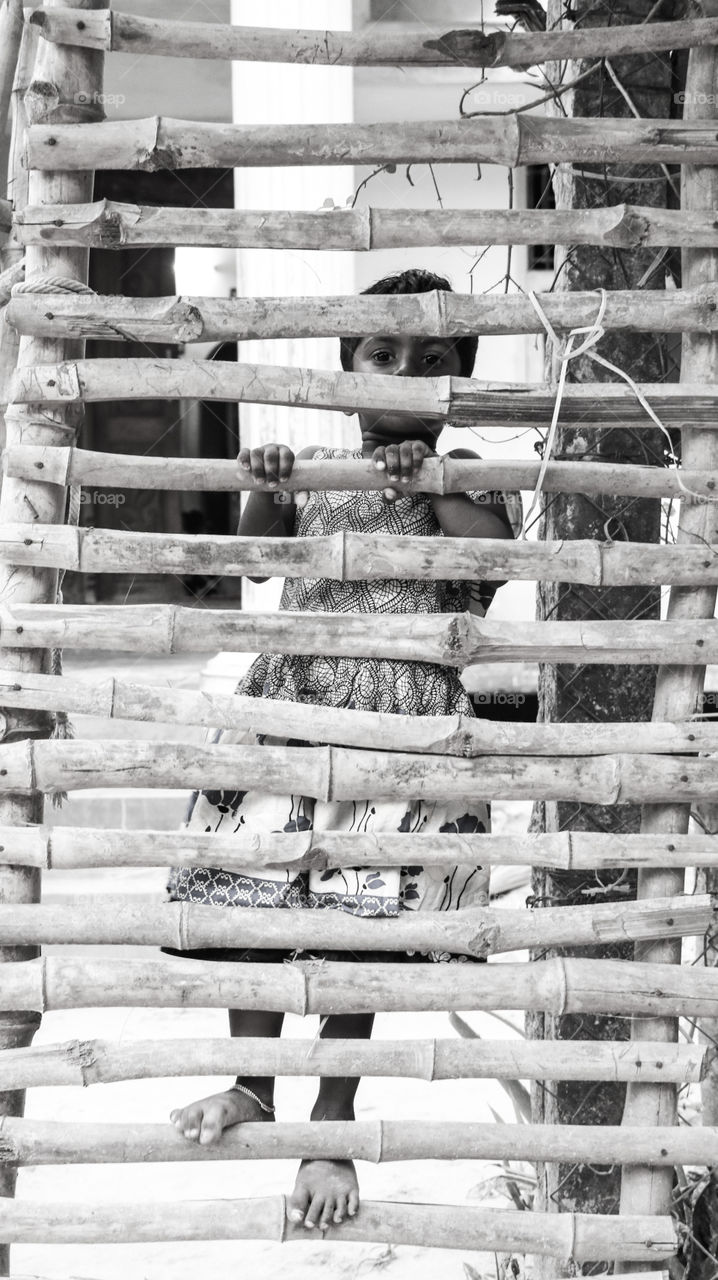 A Soulfull Story that represents the poor girl awaiting to open the gate to play with her neighbourhood