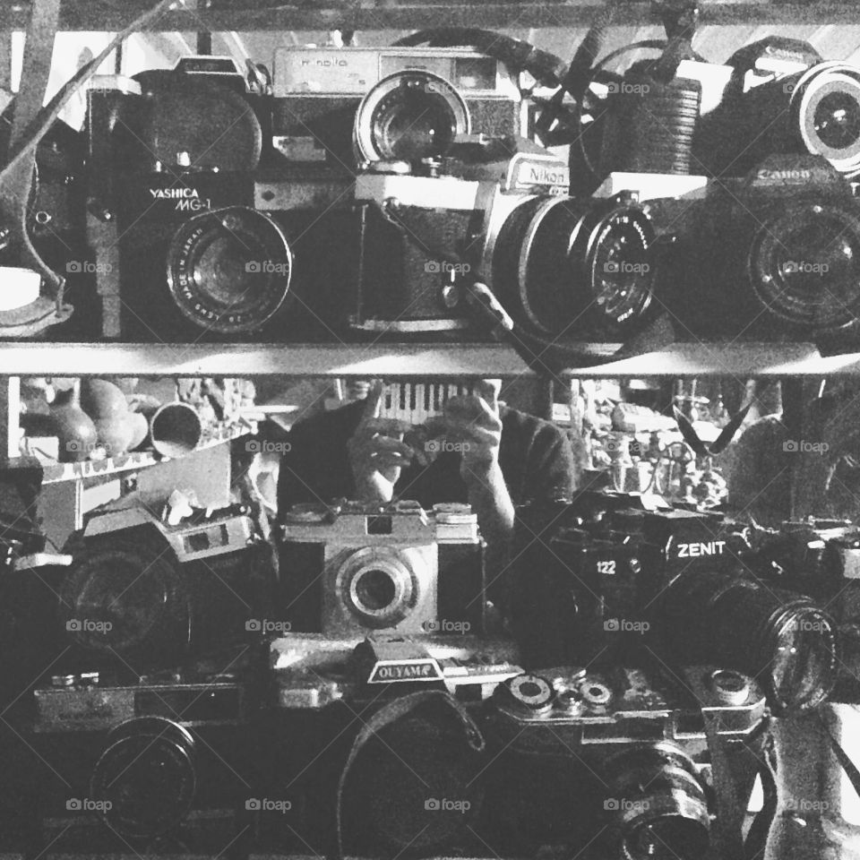 A collection of film cameras in black and white