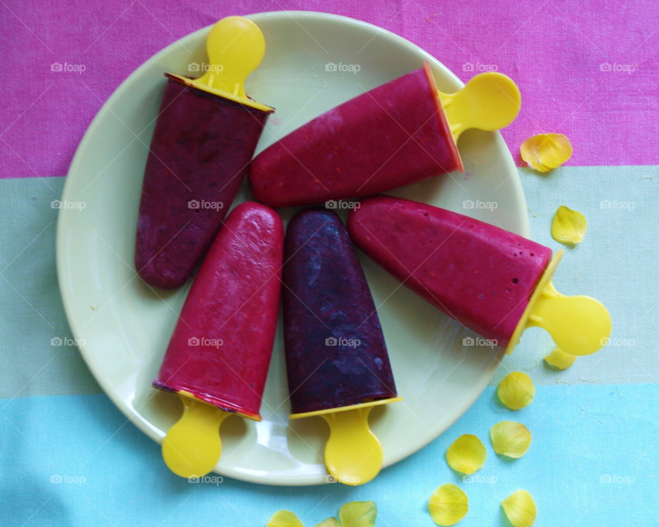 Colorful popsicles in plate