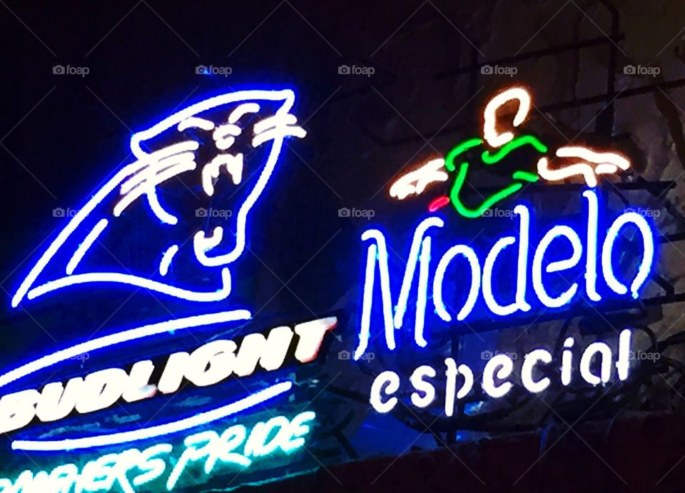 Neon lighted beer signs. Panthers pride!