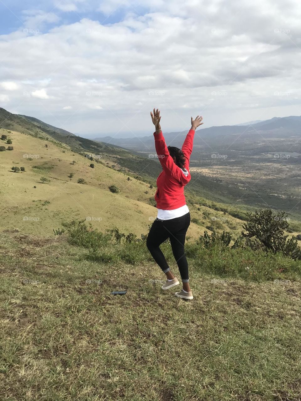 Cloud one person sky wind environment Nature full length Adult Windmill landscape mountain leisure activity day Land Jumping adventure Wind power beauty in Nature outdoors Wind Turbine in Ngong, Kenya