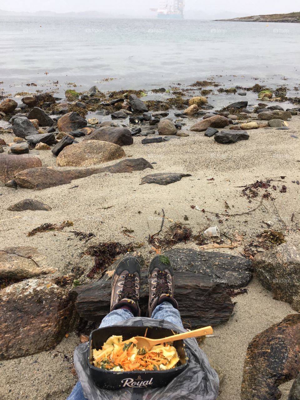 Enjoying delicious wild and healthy picnic on the island in Norway. 