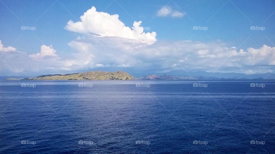 The beauty of nature, the view of the clouds over the small islands and the blue sea.