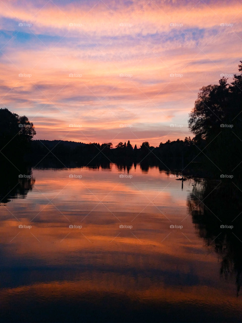 peaceful and gentle sunset by the lake