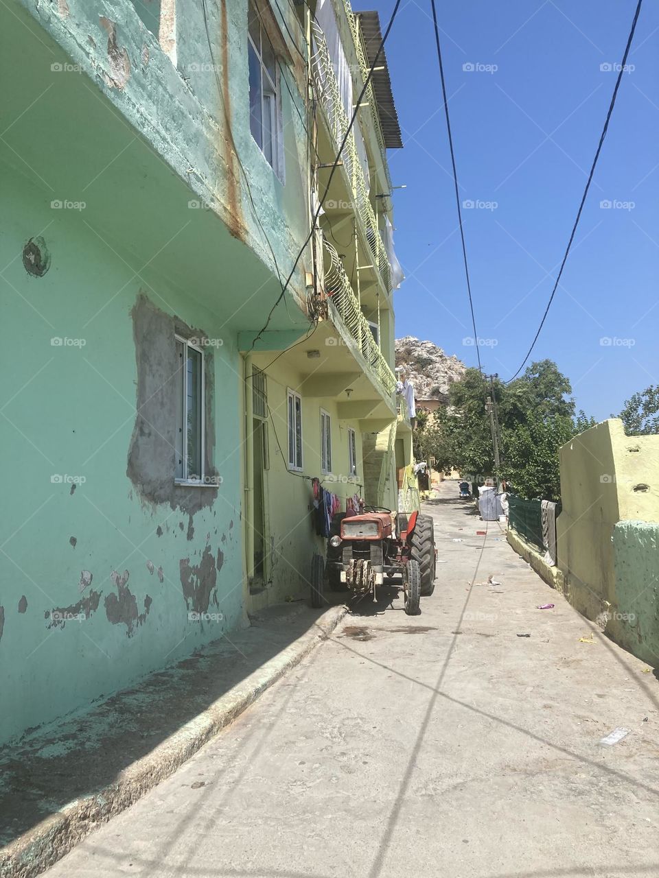 Sunny holidays I’m Turkey. Walk in the cute city and charming streets by the beach in Kusadasi. perfect blue sky and ocean view. Beach and the shore. To travel is to live. Gorgeous tall palm trees.