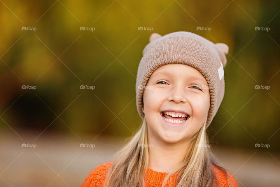 Little Caucasian girl feeling happiness outdoor 