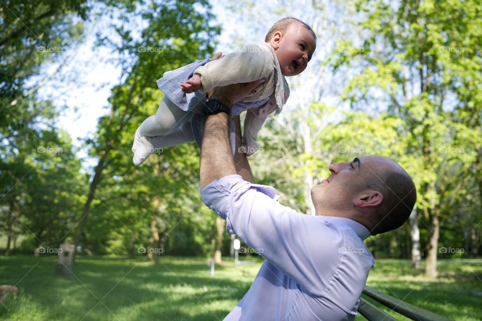 little girl flying into dad's arms