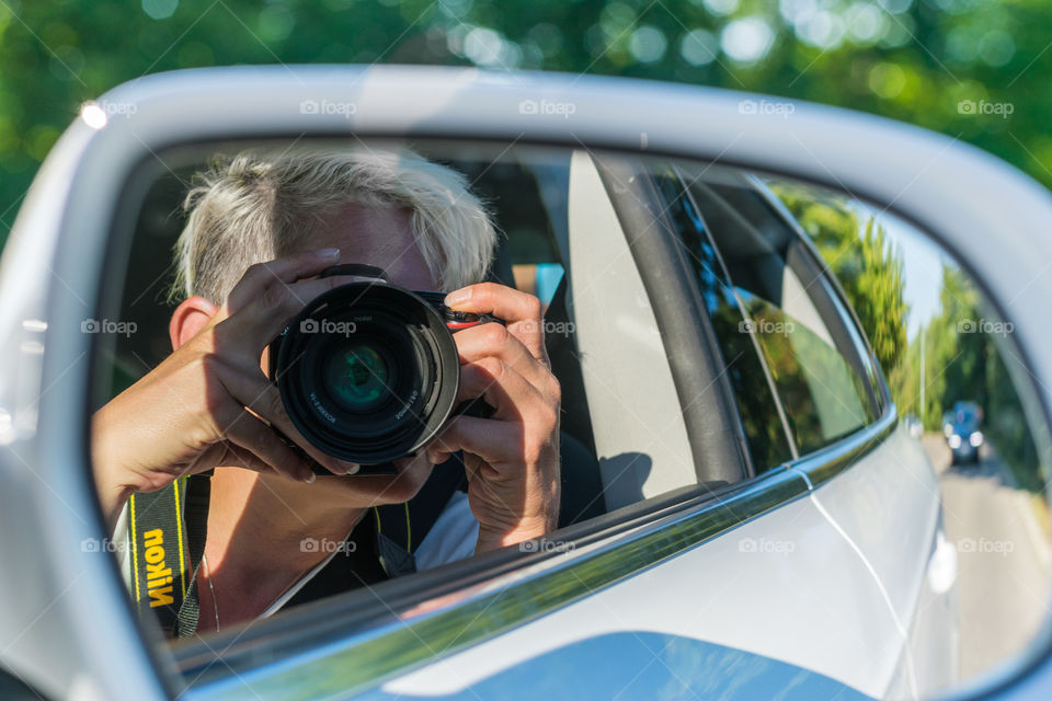 me with my Nikon making photos from my car