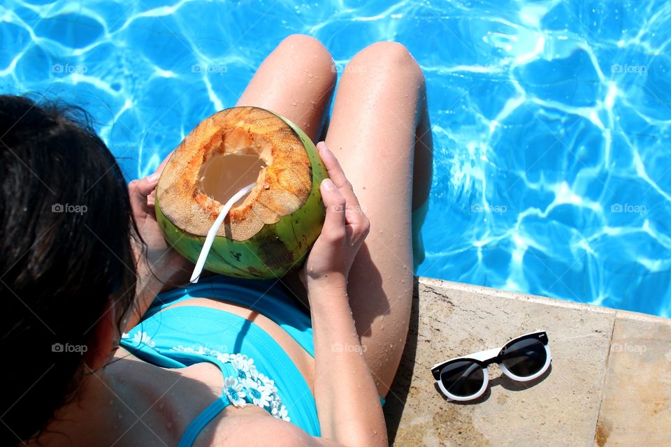 drinking refreshments by a pool