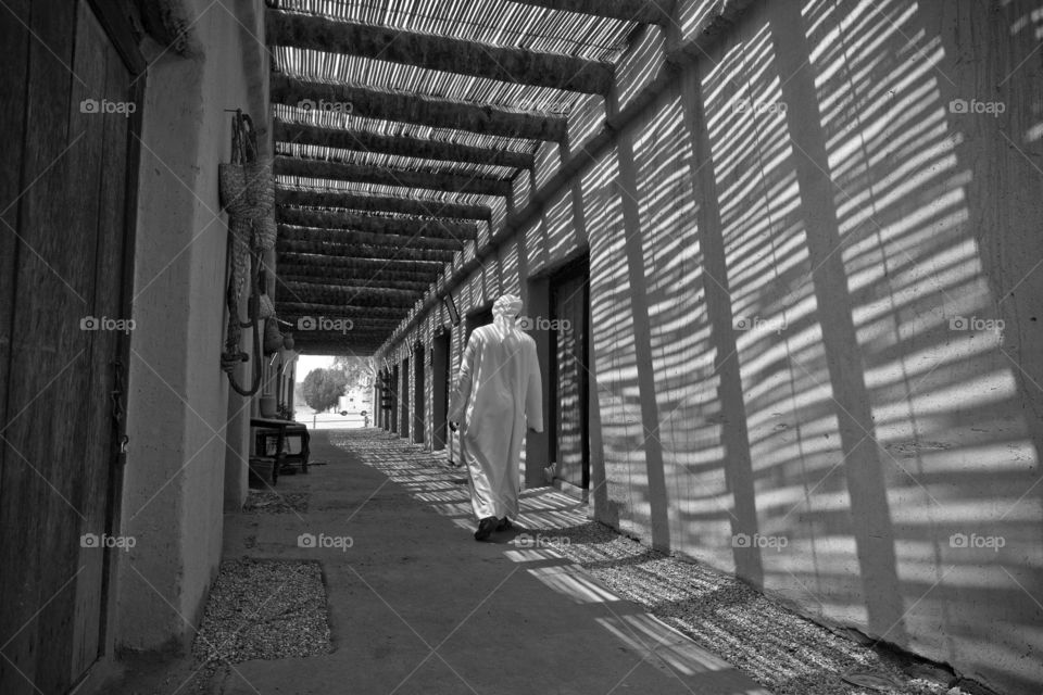 Man walking away in a traditional market in UAE