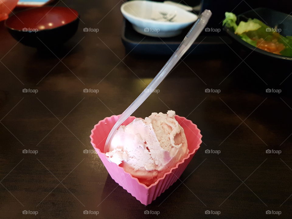 Pink sweet Ice cream dessert in heart shape container for treats