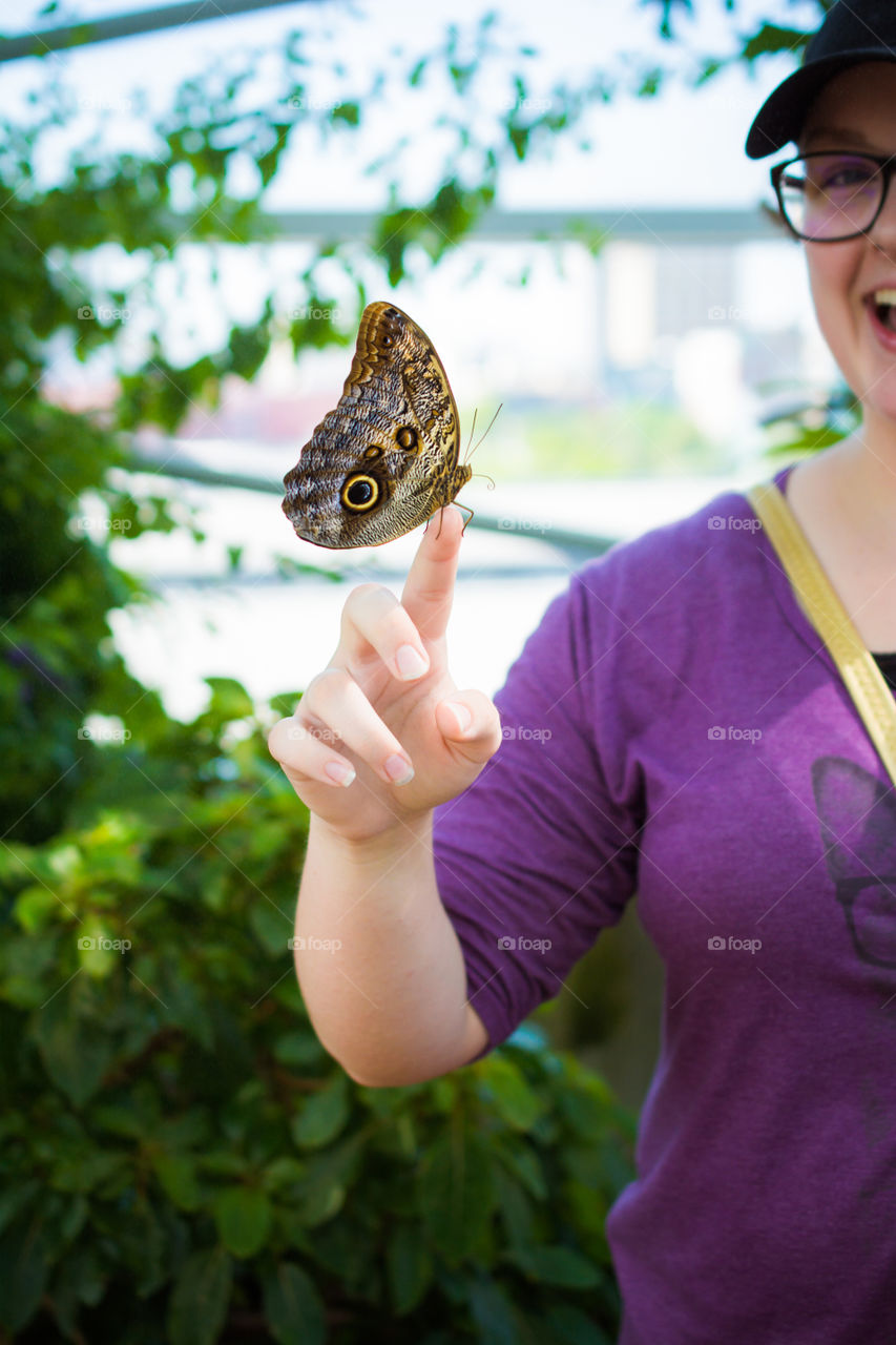 Large Butterfly on a Young Girls Hand