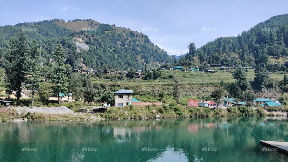 The place covered with beautiful mountains and natural lake