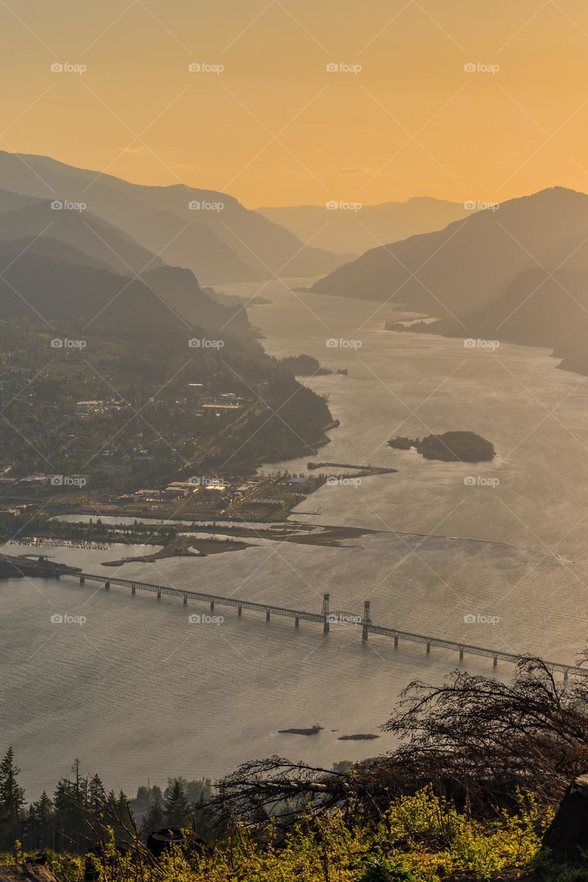 Golden hour over the majestic Columbia River Gorge landscape with views of Oregon and Washington 