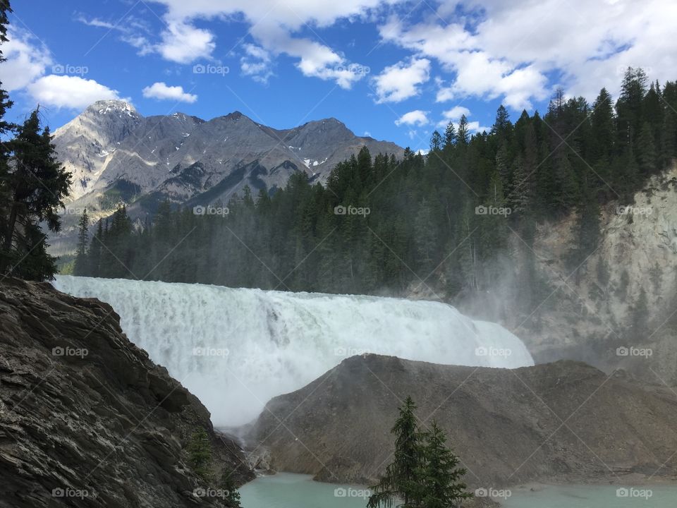 Wapta Falls is a waterfall of the Kicking Horse River located in Yoho National Park in British Columbia, Canada. It is the largest waterfall of the Kicking Horse River, at about 30 metres high and 150 metres wide.