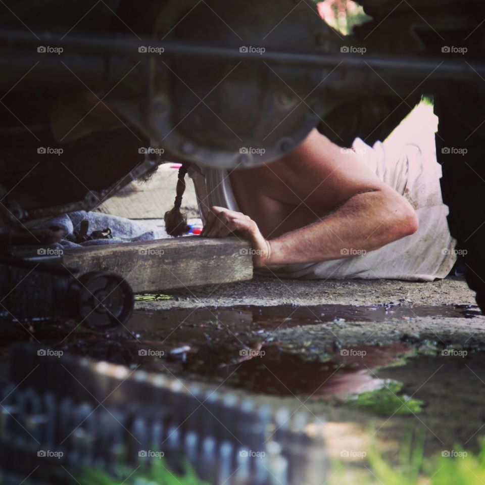 From underneath the truck.
