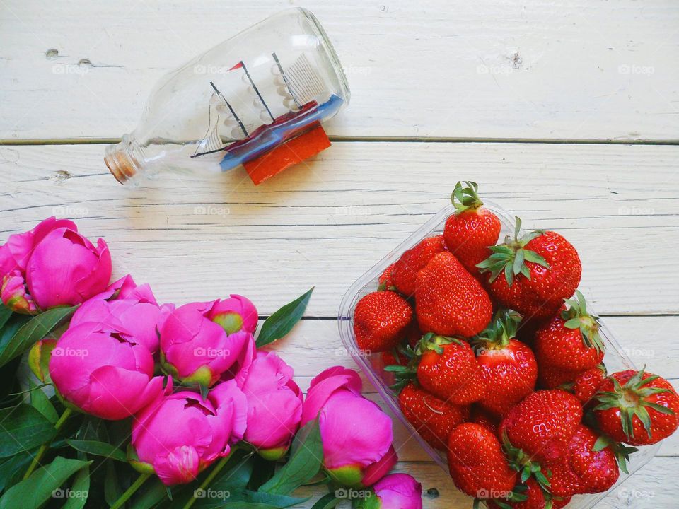 flowers peonies and strawberries