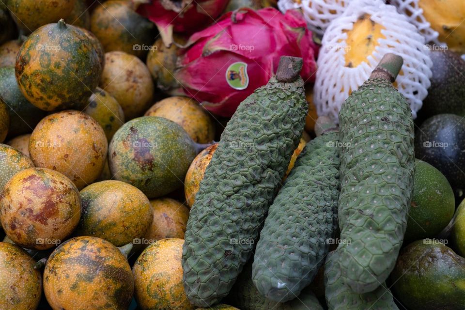 A close up view of a variety of exotic and tropical fruits at the market in Spring