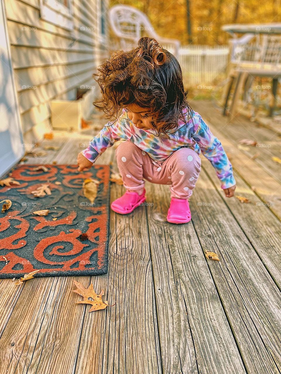 Little girl with wild curls inspects wild life, toddler girl with curly hair looking at caterpillar, toddler girl outside in nature, toddler enjoys the outdoors, wild hair don’t care, hair is the best accessory 