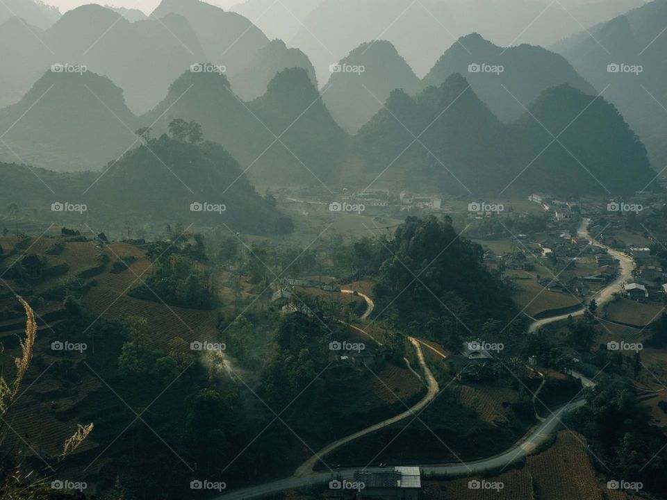 A picture of a beautiful road and mountains