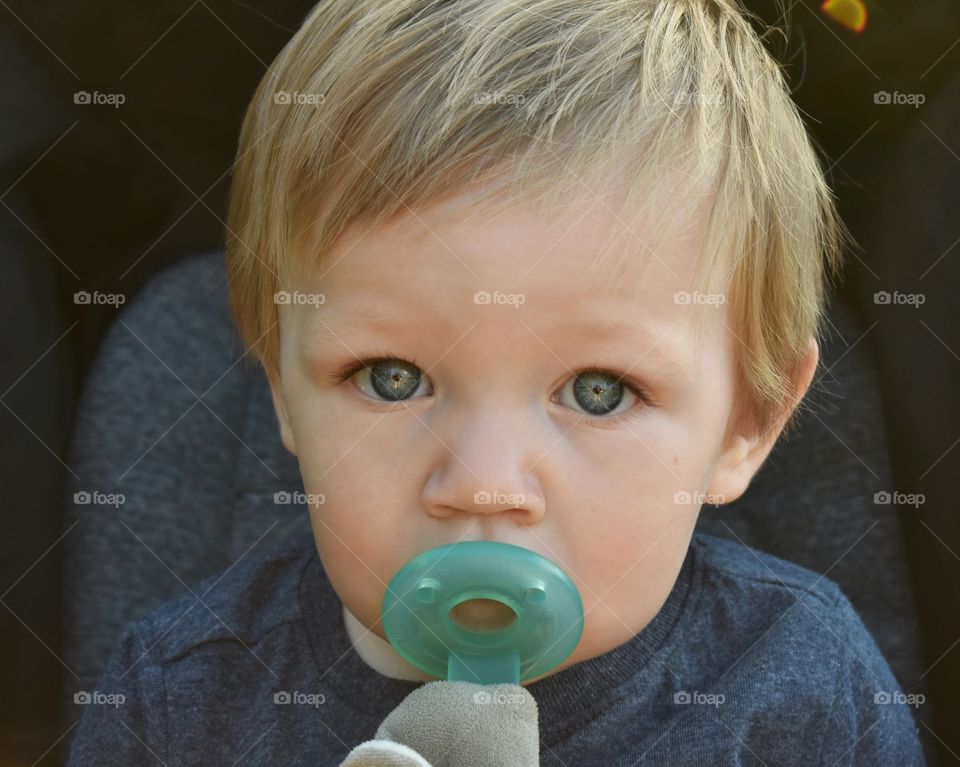 Cute baby boy with pacifier