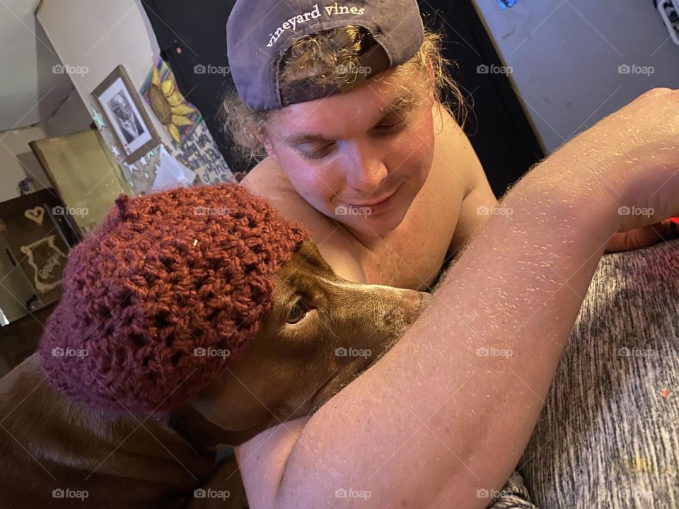 Smiling at her crochet hat