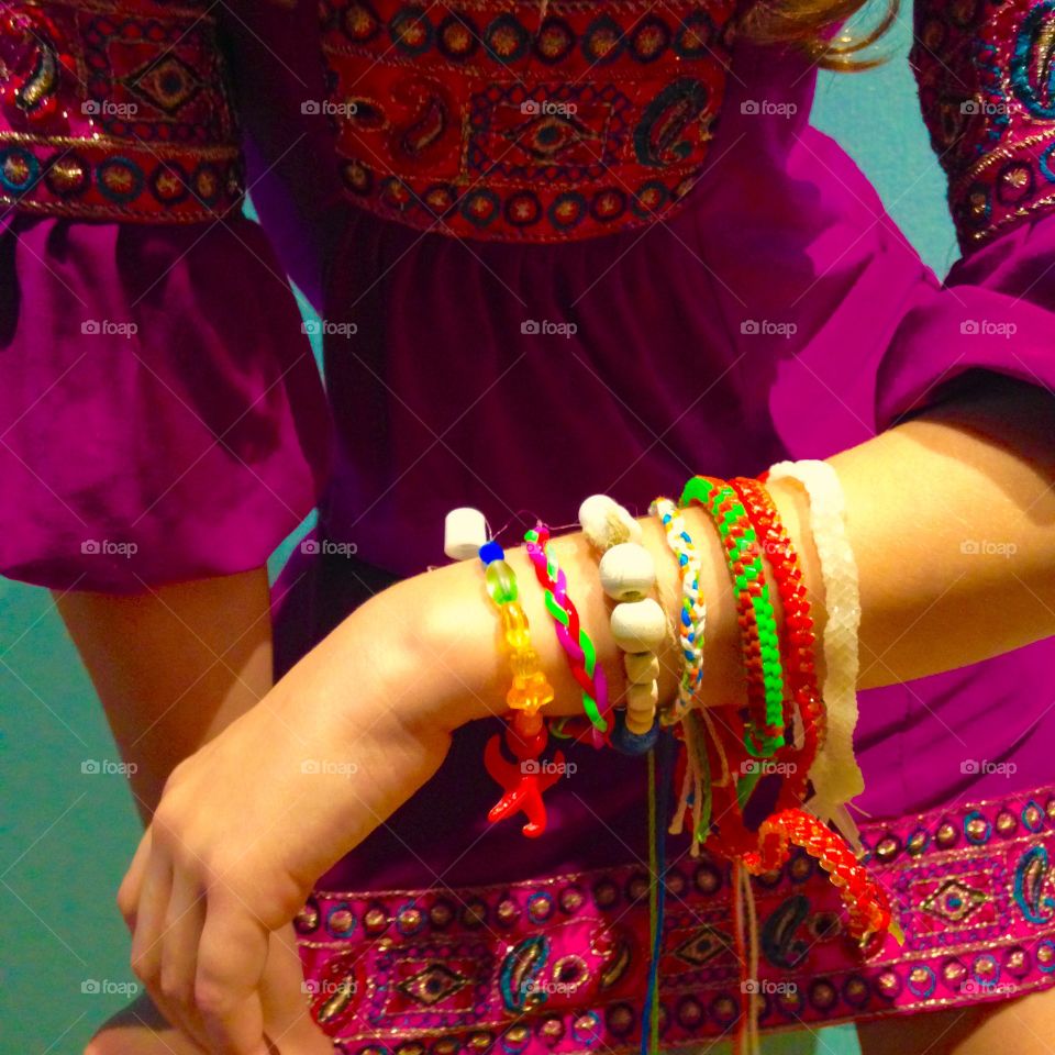 Beautiful, handmade, hand crafted bracelets of various materials, shapes and sizes, all on the wrist of the maker