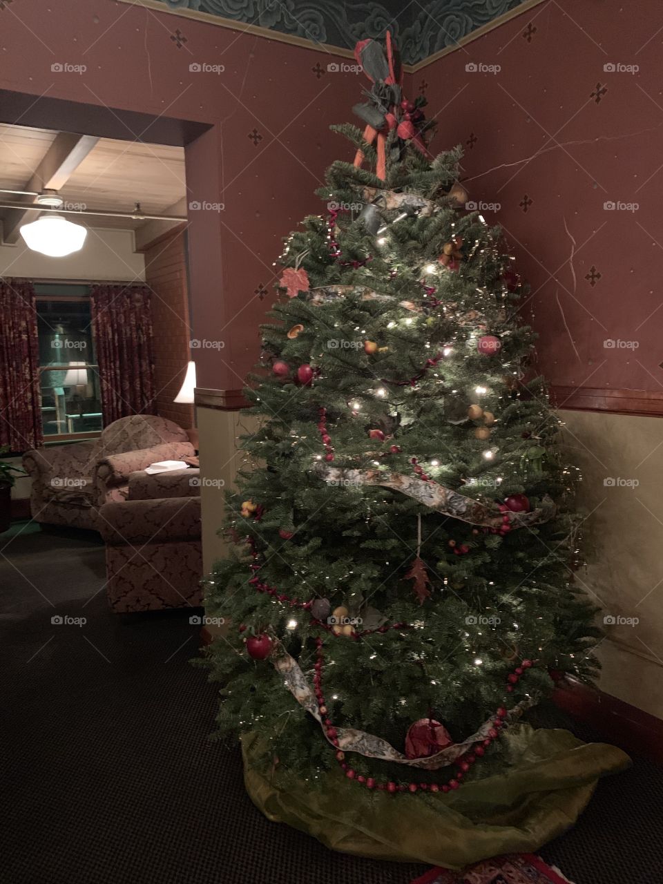 A decorated Christmas tree stands in the corner of the Edgefield Hotel in Troutdale, OR. 