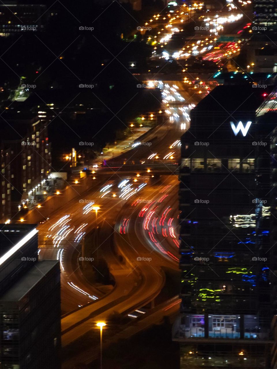 A busy downtown freeway with a one second exposure demonstrates the constant flow of traffic