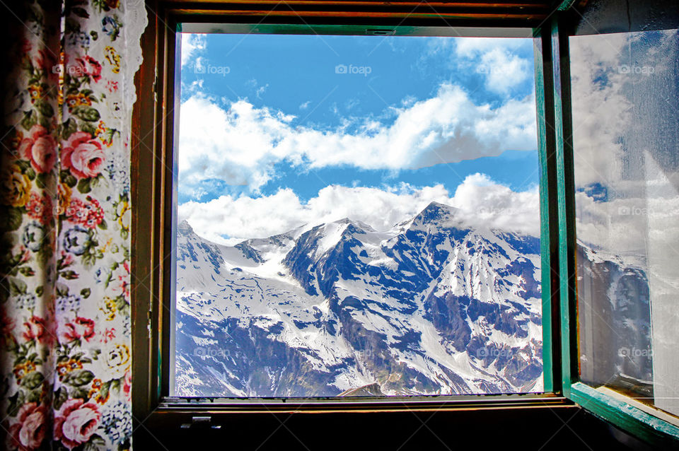 View of mountain through wnidow