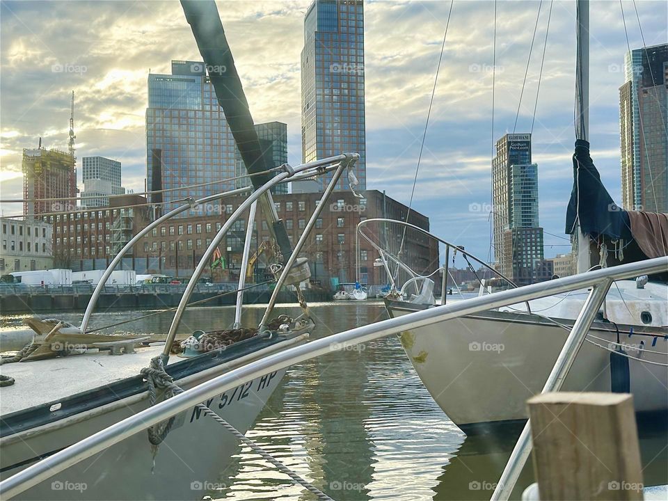 This dramatic naval scenario offers itself daily thru the window of “Salvation”, the “28 ft 1969 Luhrs” cabin cruiser I and my longtime partner “Timothy Trespas” call our home on the sea at “Newtown Creek” in LIC, Queens. 2023. Hypnotic Productions