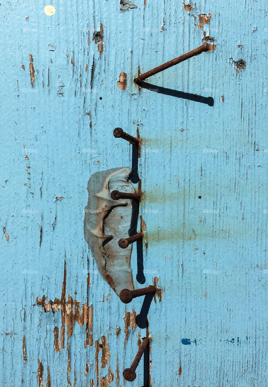 Shabby chic old painted weathered wood plank board painted Aqua turquoise with old vintage rusted nails square heads 