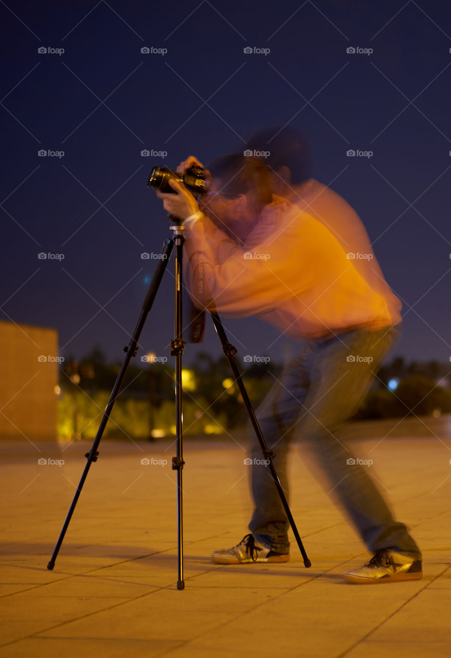 Man photographing at night