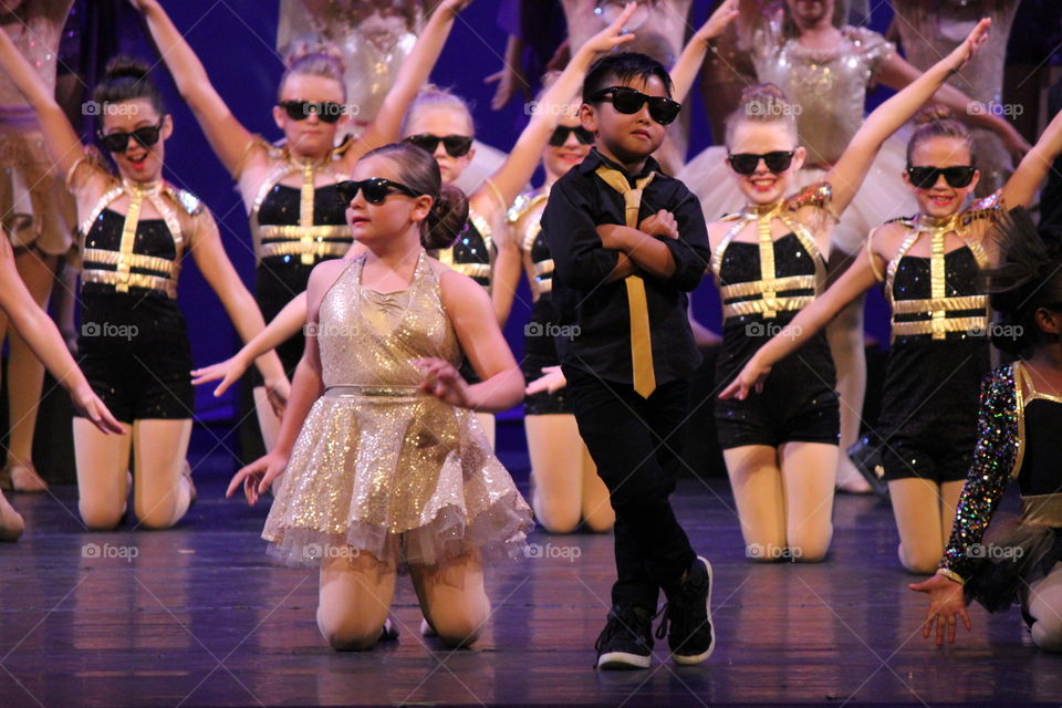 Show me the moves. Kids performing at dance recital