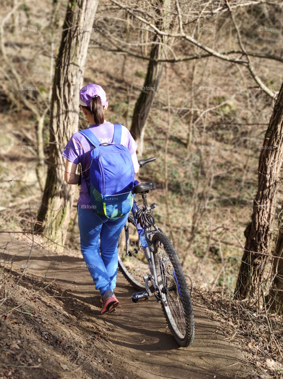 Forest walk with a bike