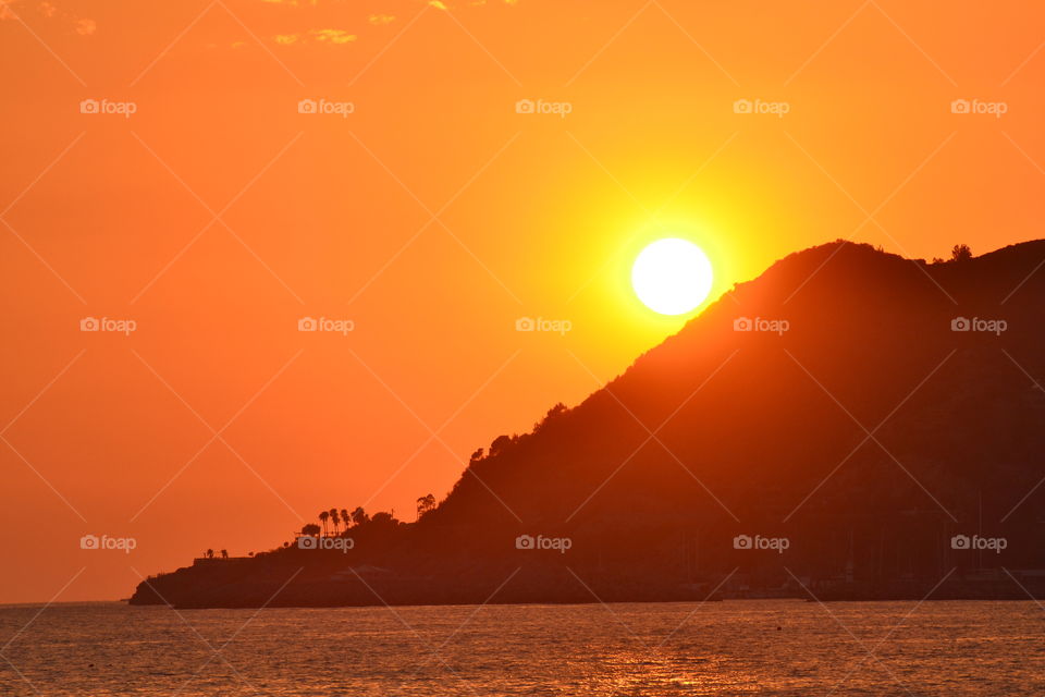 Silhouette of mountain during sunset