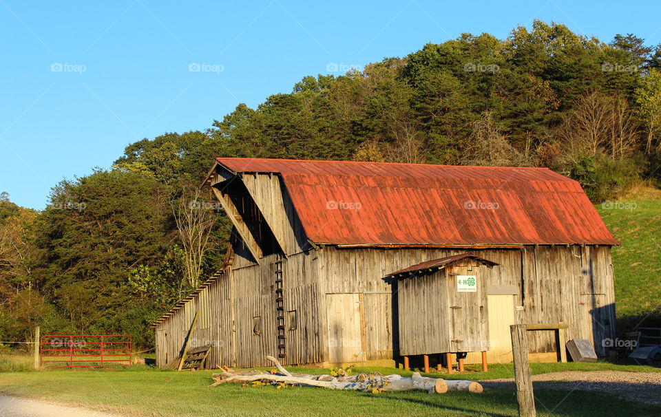 Wooden barn with metal rusted roof