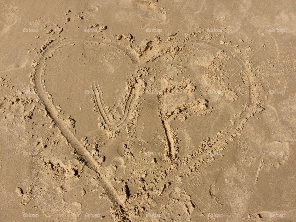 Declaration of love on the sand of the beach