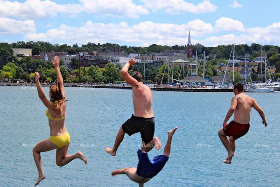 Jumping off the breakwater into Lake Michigan